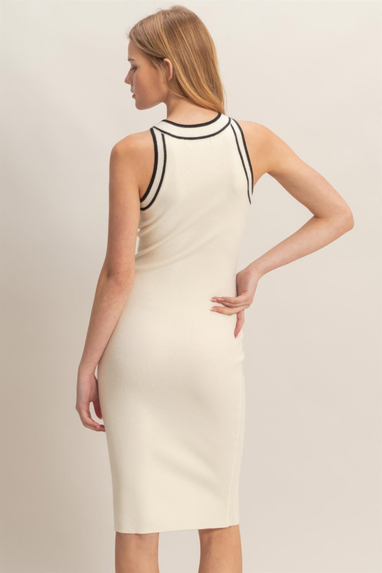Ribbed sleeveless dress in ivory with black-trim back and slim pencil fit