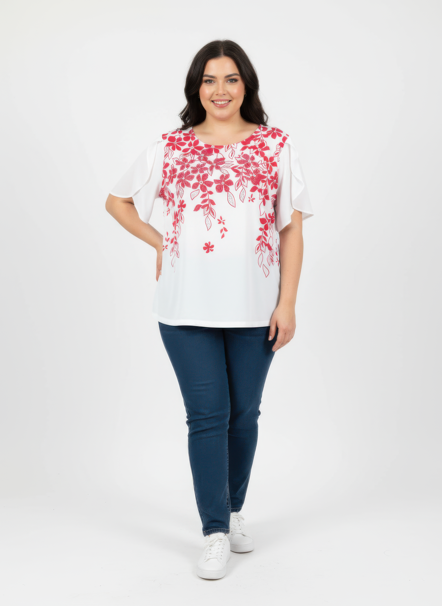 Floral print knit top with flutter sleeves; red-and-white botanical pattern on white base