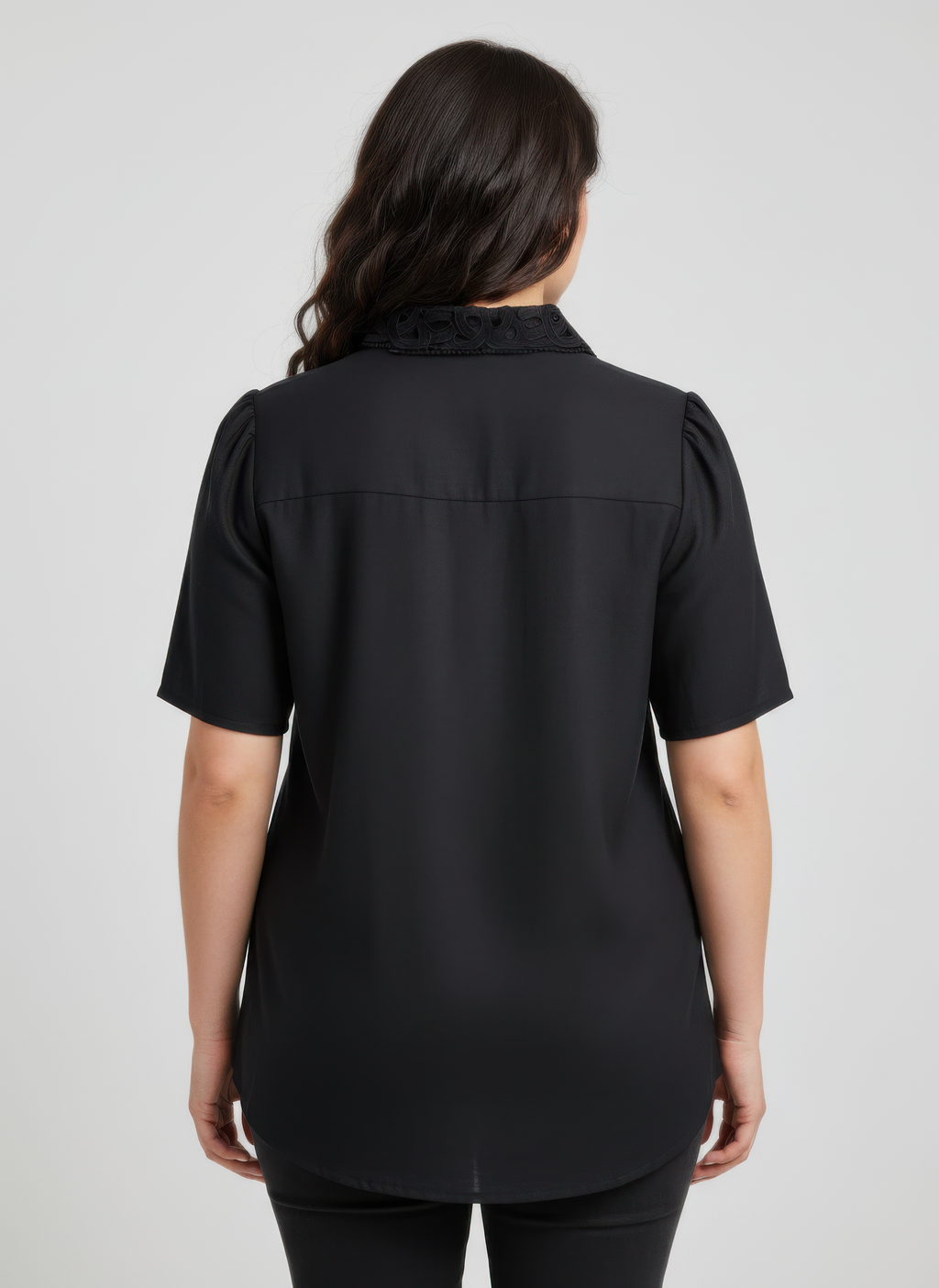 Back view: dark lace-trim button-front collared blouse with short sleeves