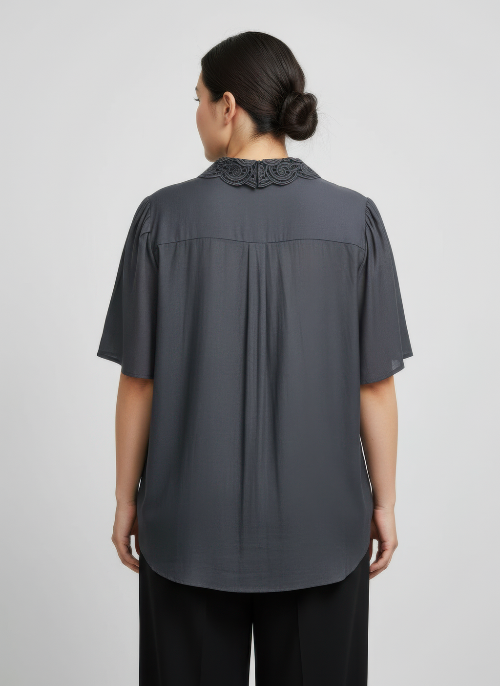 Back view of dark grey lace-collar button detail flutter sleeve top, short sleeves