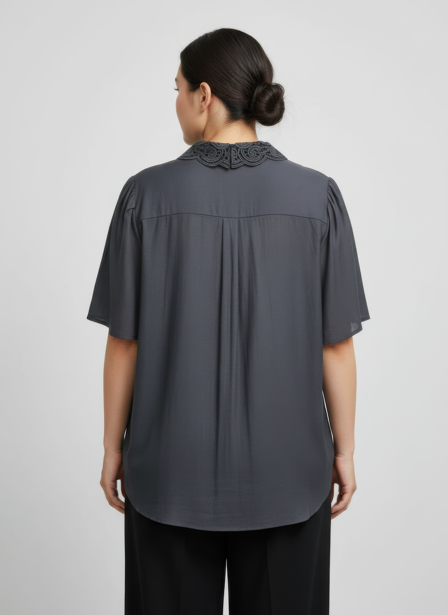 Back view of dark grey lace-collar button detail flutter sleeve top, short sleeves