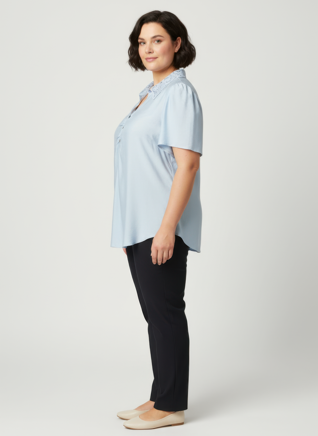 Light blue flutter sleeve top with lace collar detail and button placket, side view
