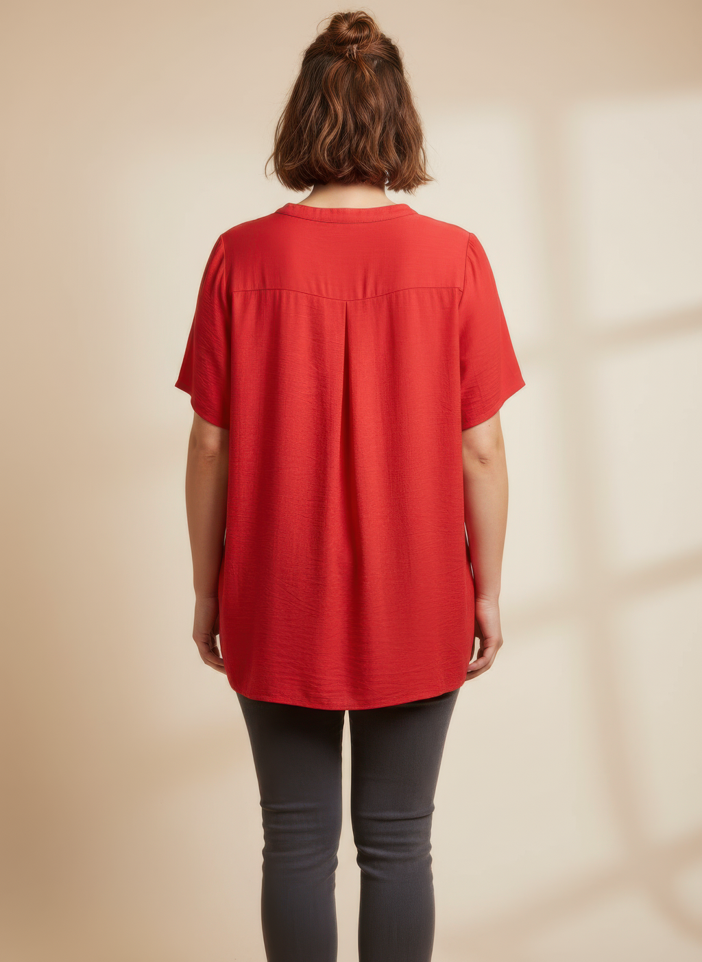 Red knit utility top, back view with split hem detail