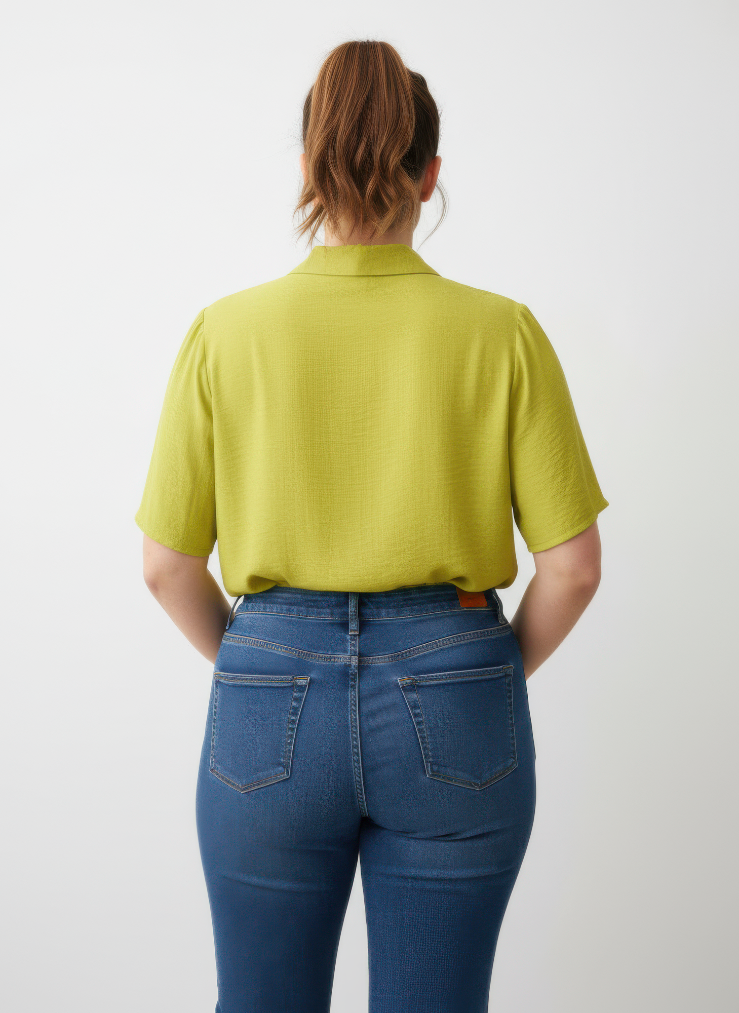 Back view of yellow collared knit tunic top, short sleeves
