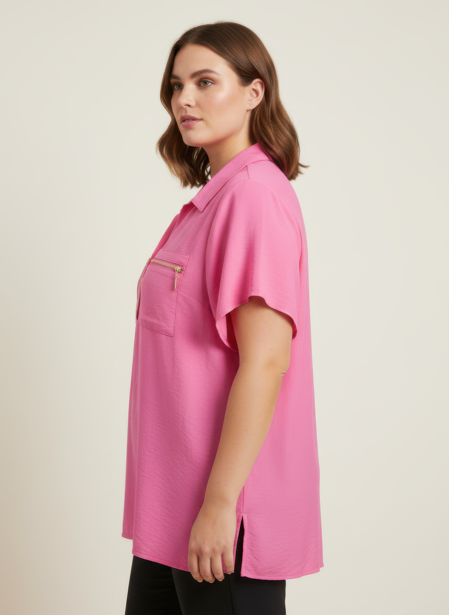 Pink collared knit tunic top with zip chest pockets and short sleeves
