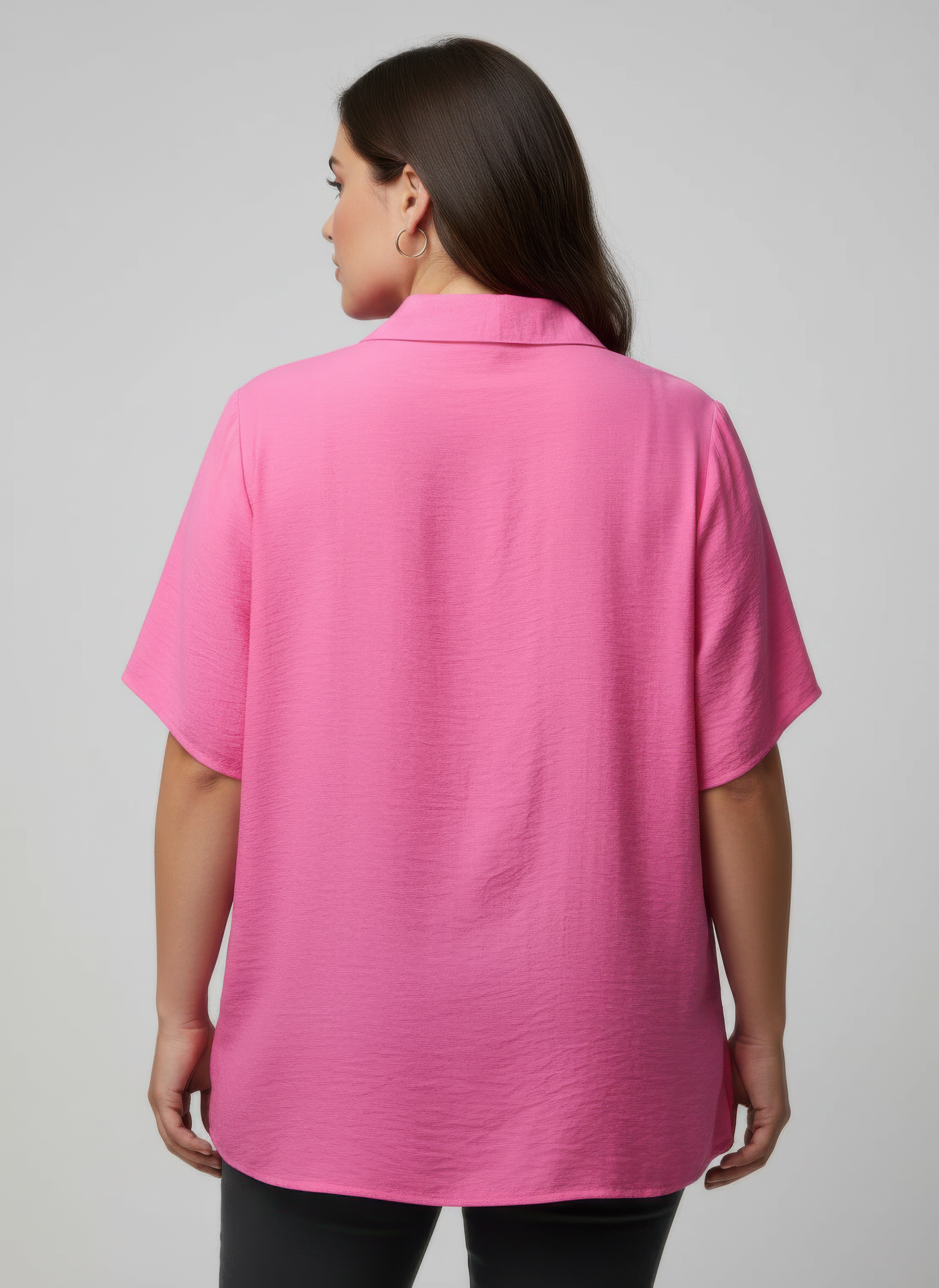 Back view of pink collared knit tunic top with short sleeves