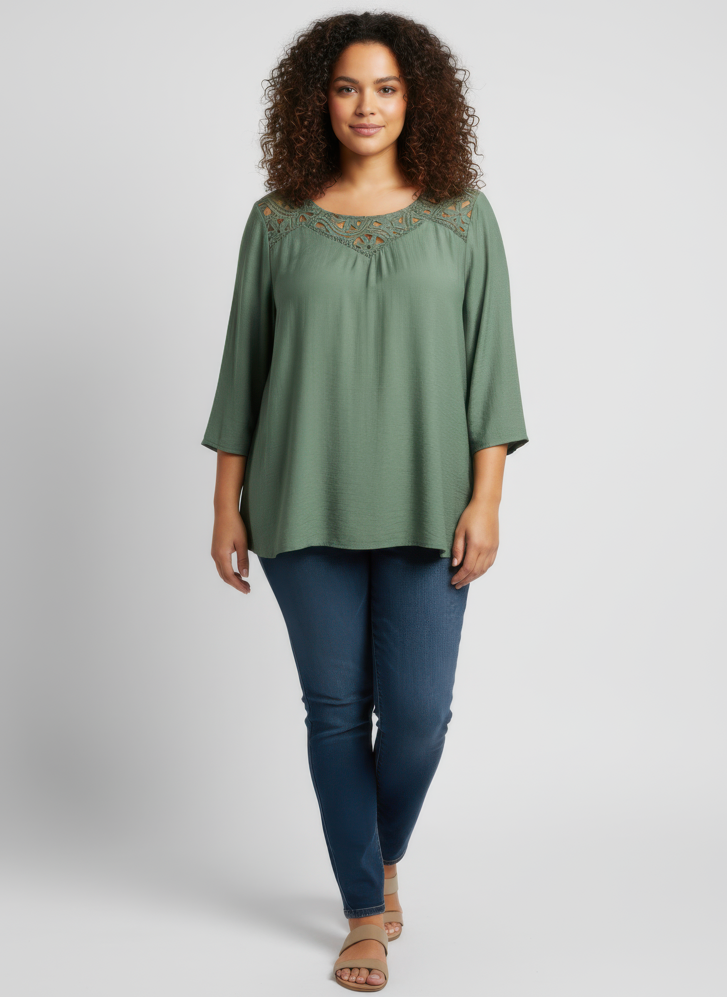 Green lace yoke knit tunic, front view with embroidered neckline detail
