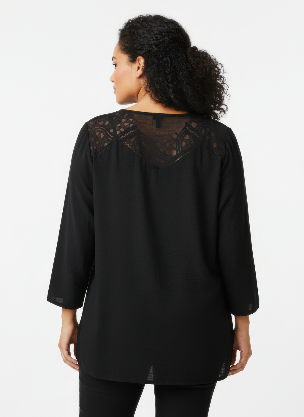 Black lace yoke knit tunic, back view with cutout lace detail on yoke
