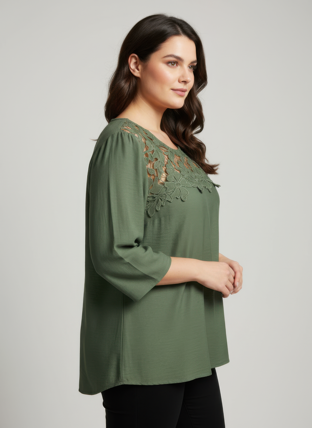 Green knit top with lace yoke and 3/4 sleeves, side view