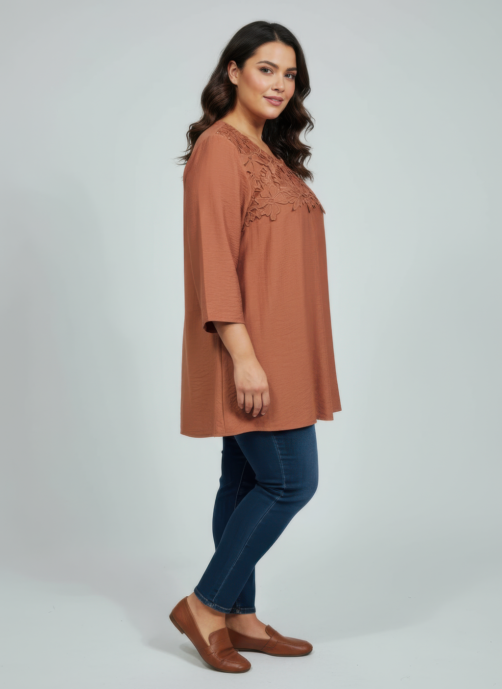 Rust lace yoke knit top with 3/4 sleeves, side view
