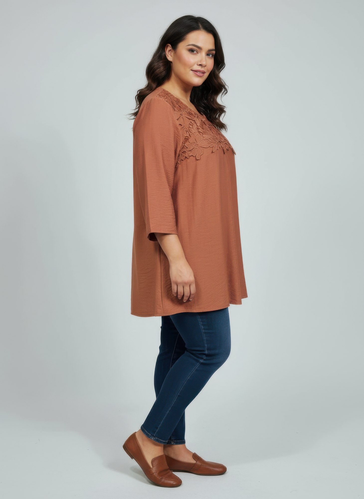 Rust lace yoke knit top with 3/4 sleeves, side view