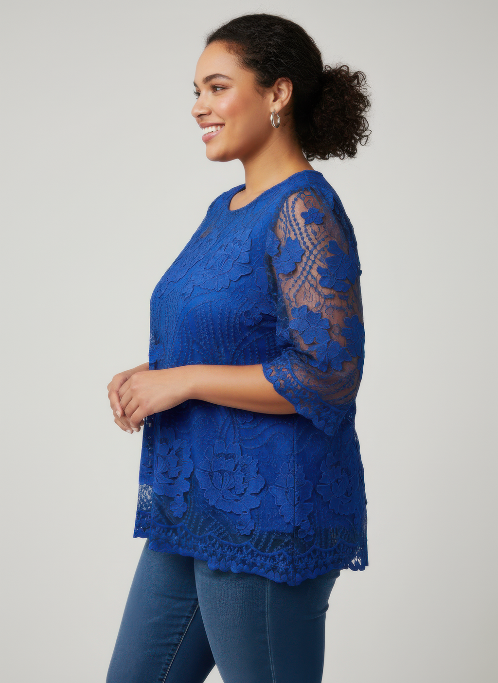 Royal blue floral lace blouse with mesh sleeves and scalloped hem edge