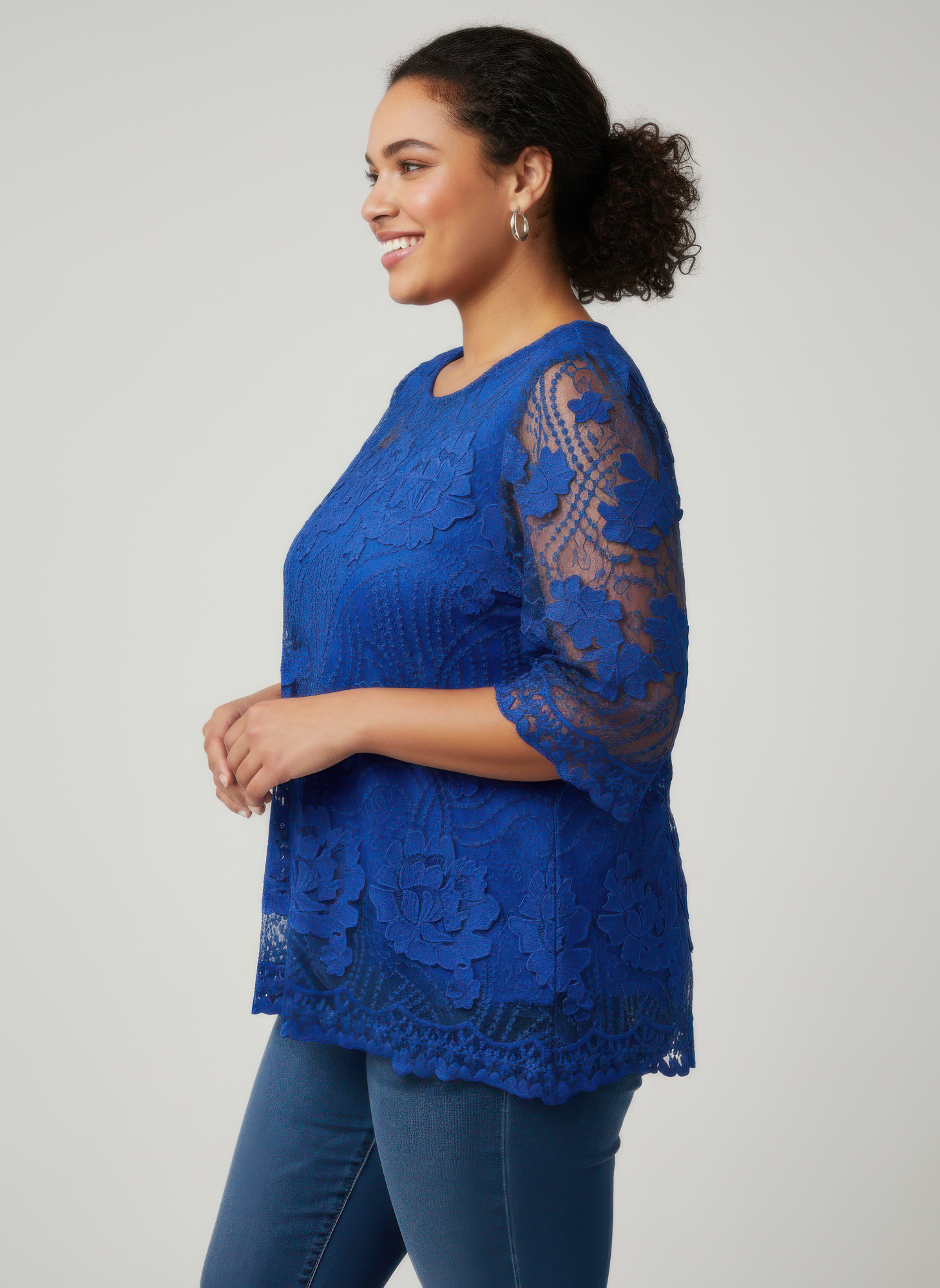Royal blue floral lace blouse with mesh sleeves and scalloped hem edge