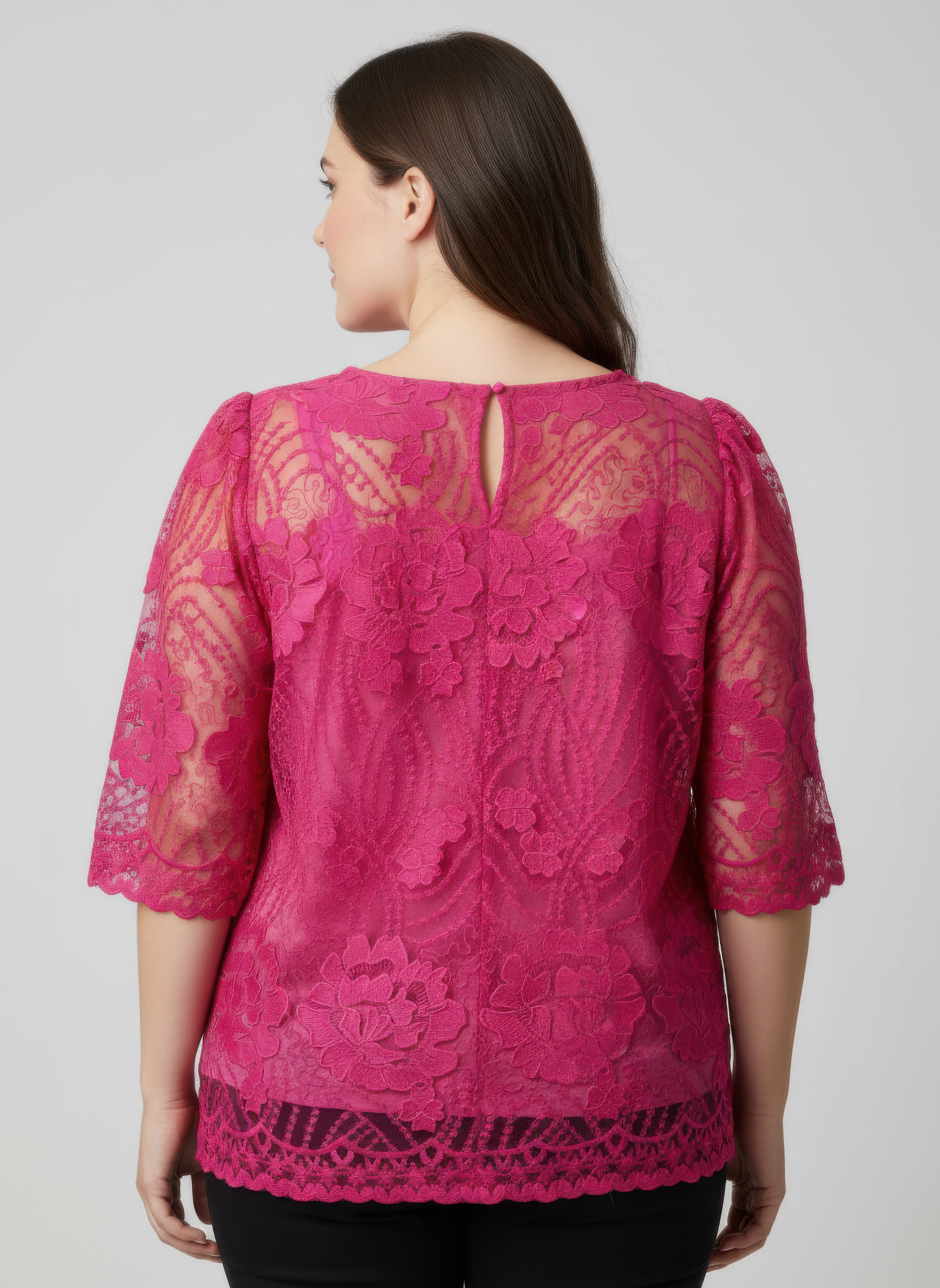 Back view: pink floral lace blouse with scalloped hem and short sleeves