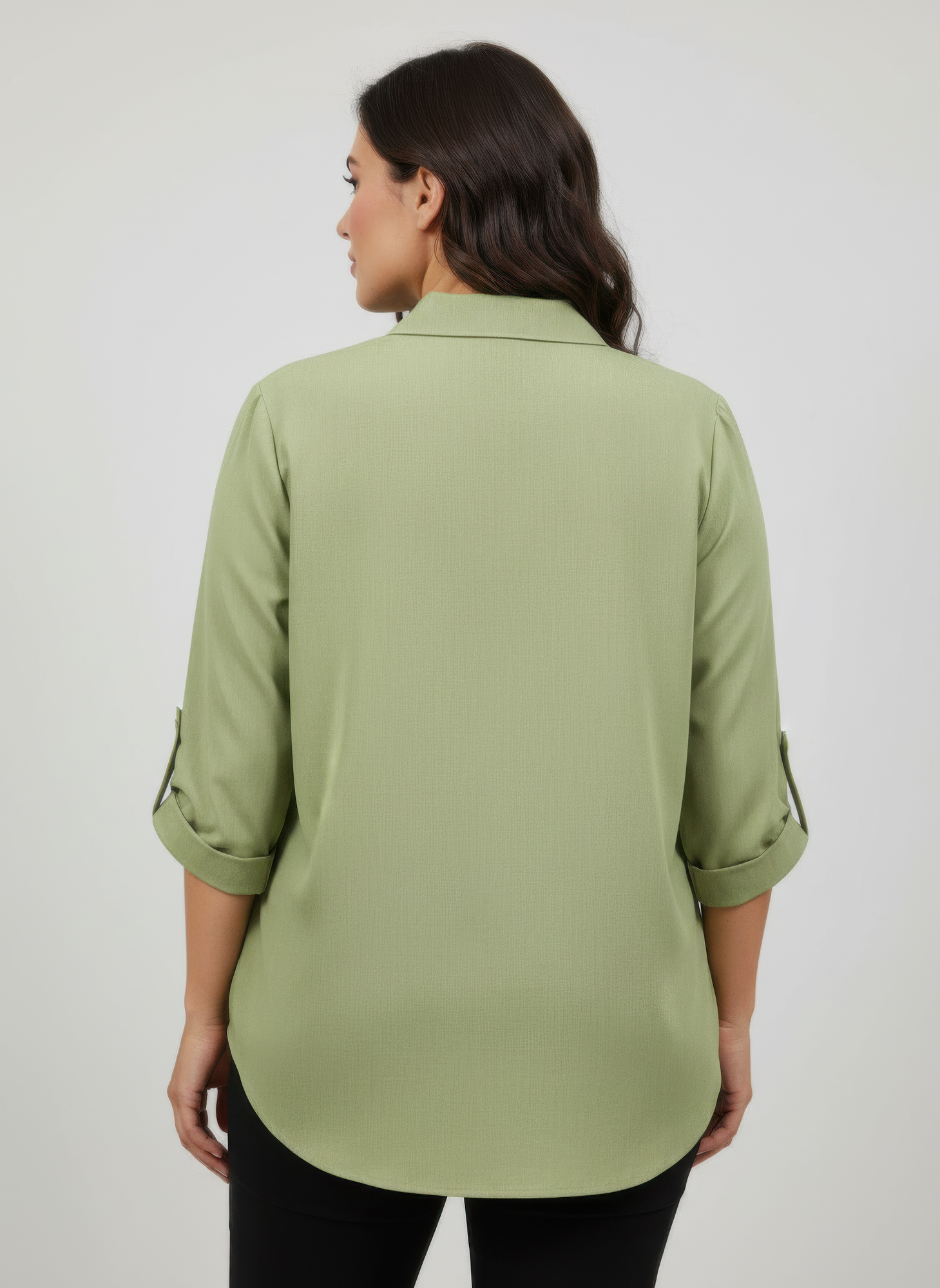 Back view of green zip-front utility pocket tunic blouse with 3/4-length sleeves