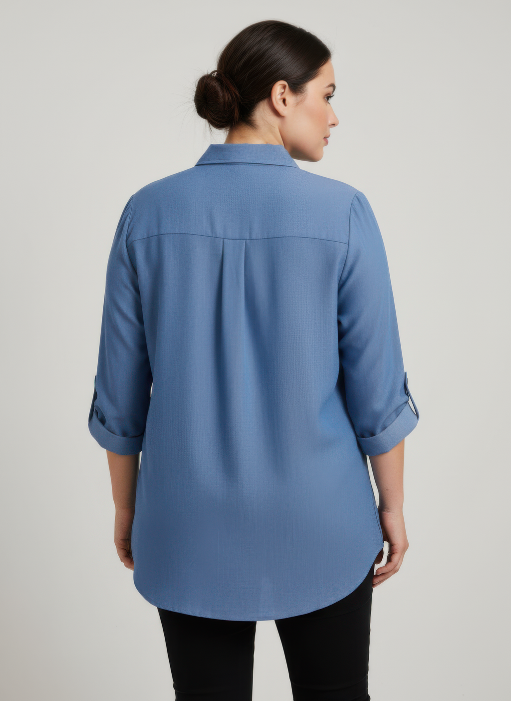 Back view of blue zip-front utility pocket tunic blouse with 3/4-length sleeves