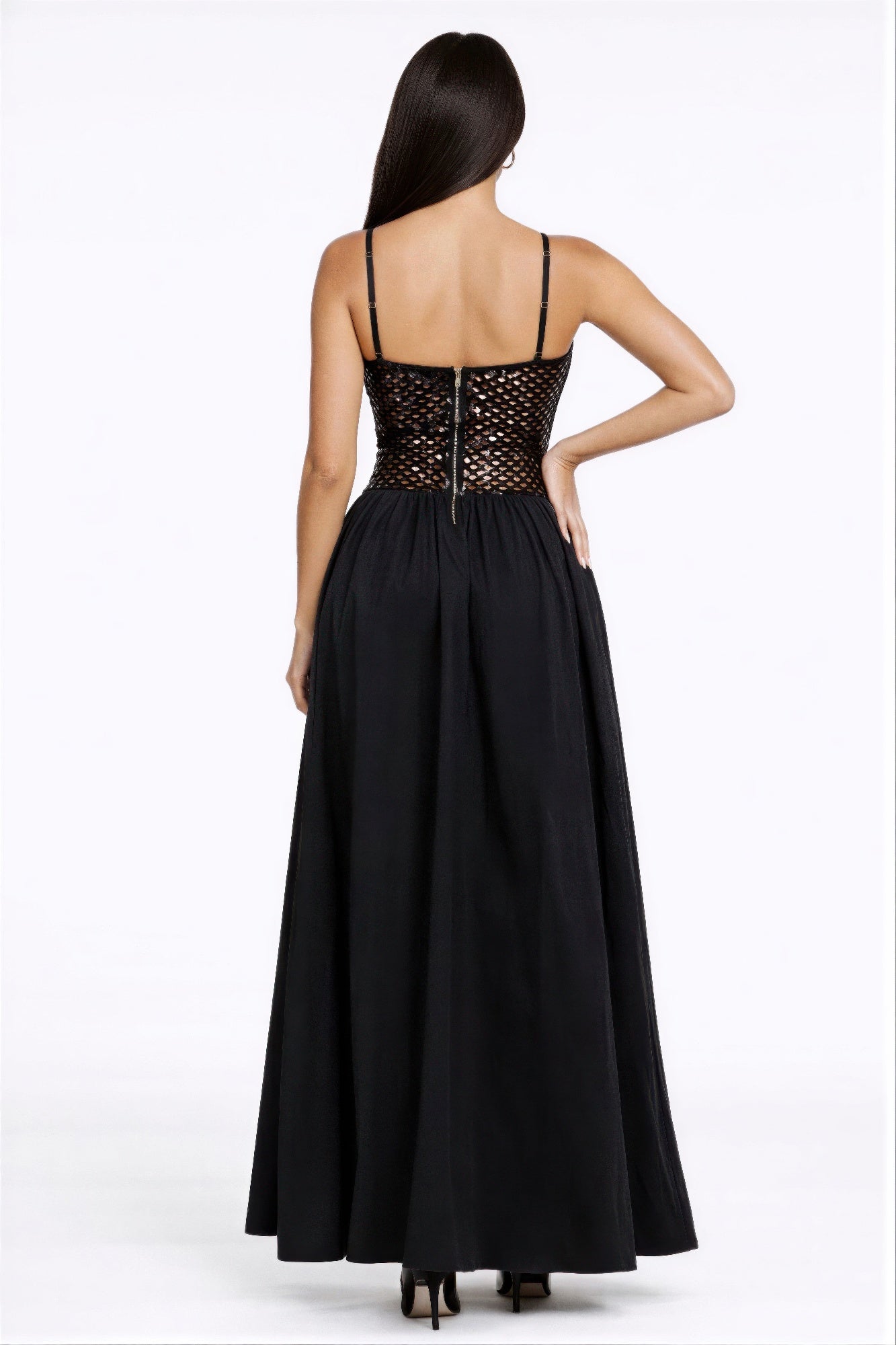 Back view of black netted sequin maxi dress with adjustable straps and full skirt