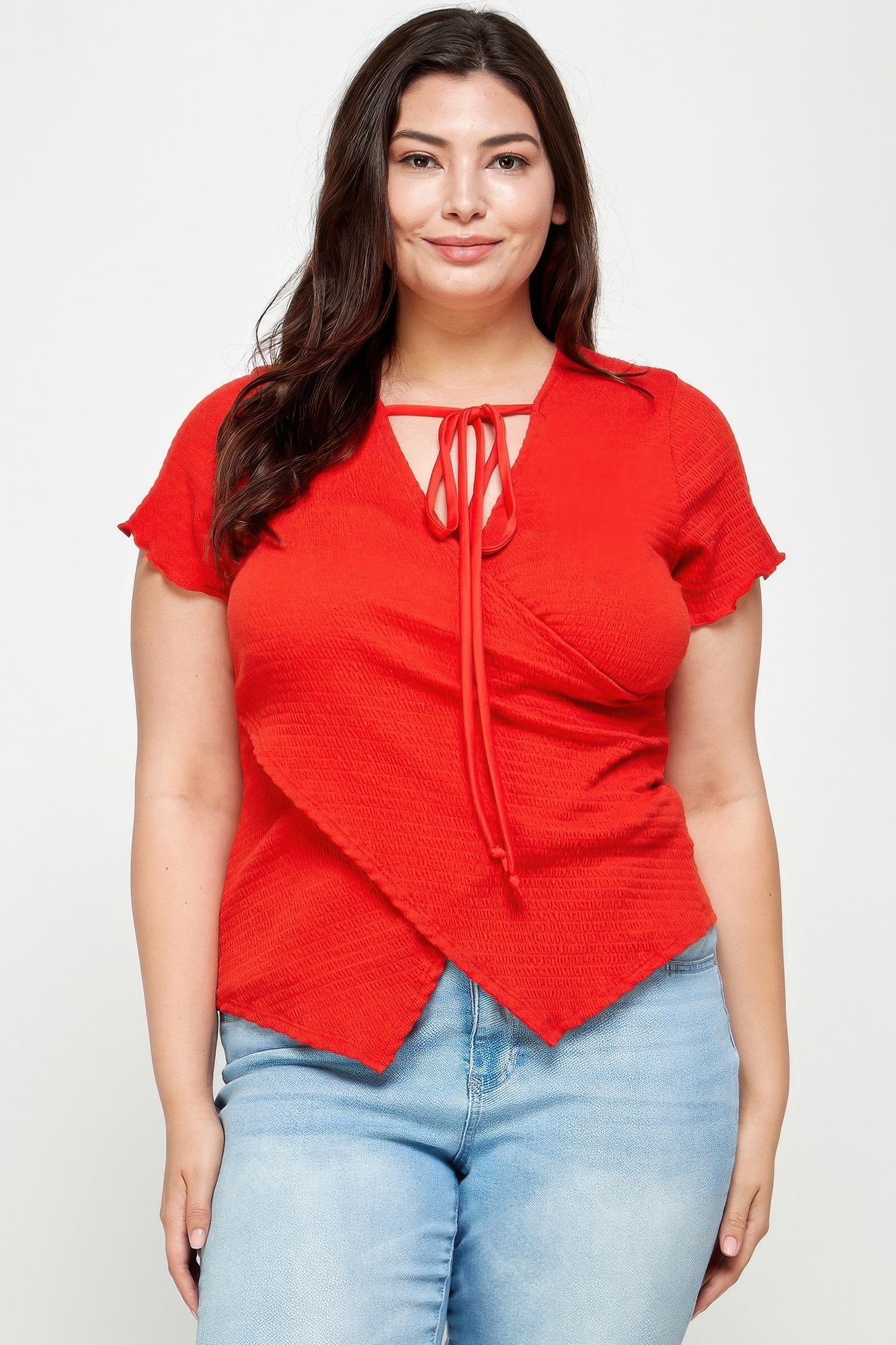 Red textured wrap top with tie-neck ribbon, short sleeves, plus size