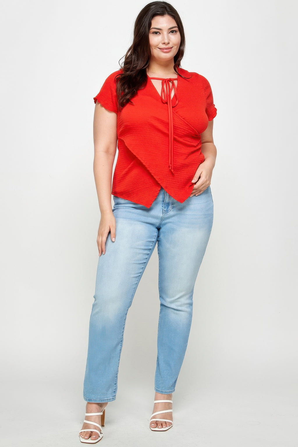 Red textured wrap top with tie-neck drawstring, short sleeves, crossed front