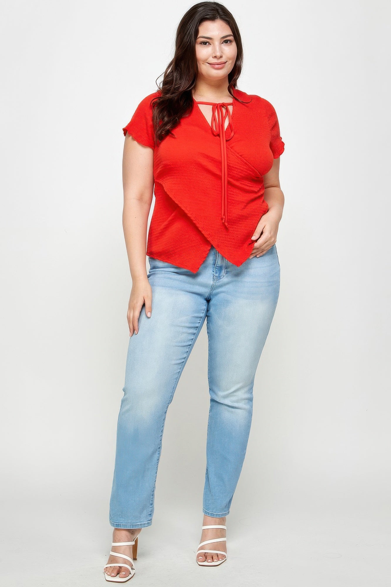 Red textured wrap top with tie-neck drawstring, short sleeves, crossed front