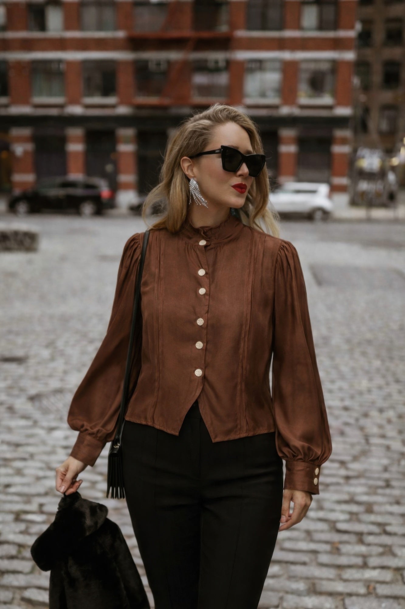 Brown Victorian button-up blouse with stand collar, long puff sleeves, and rounded button front