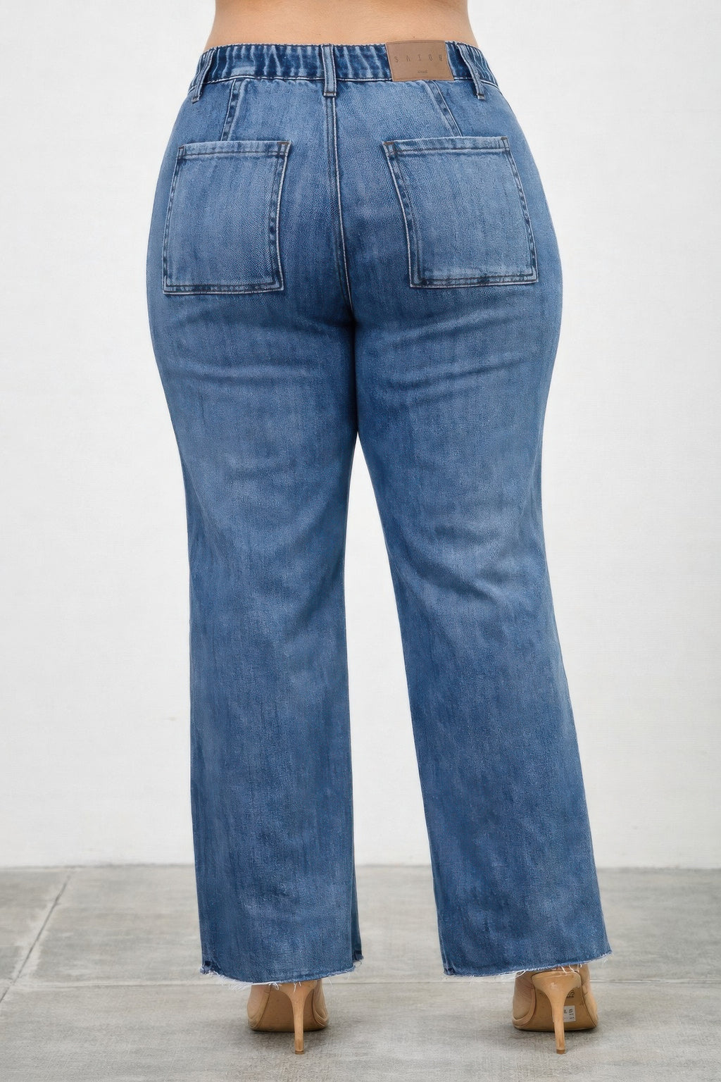 High-rise straight jeans back view with two rear pockets and subtle front lines