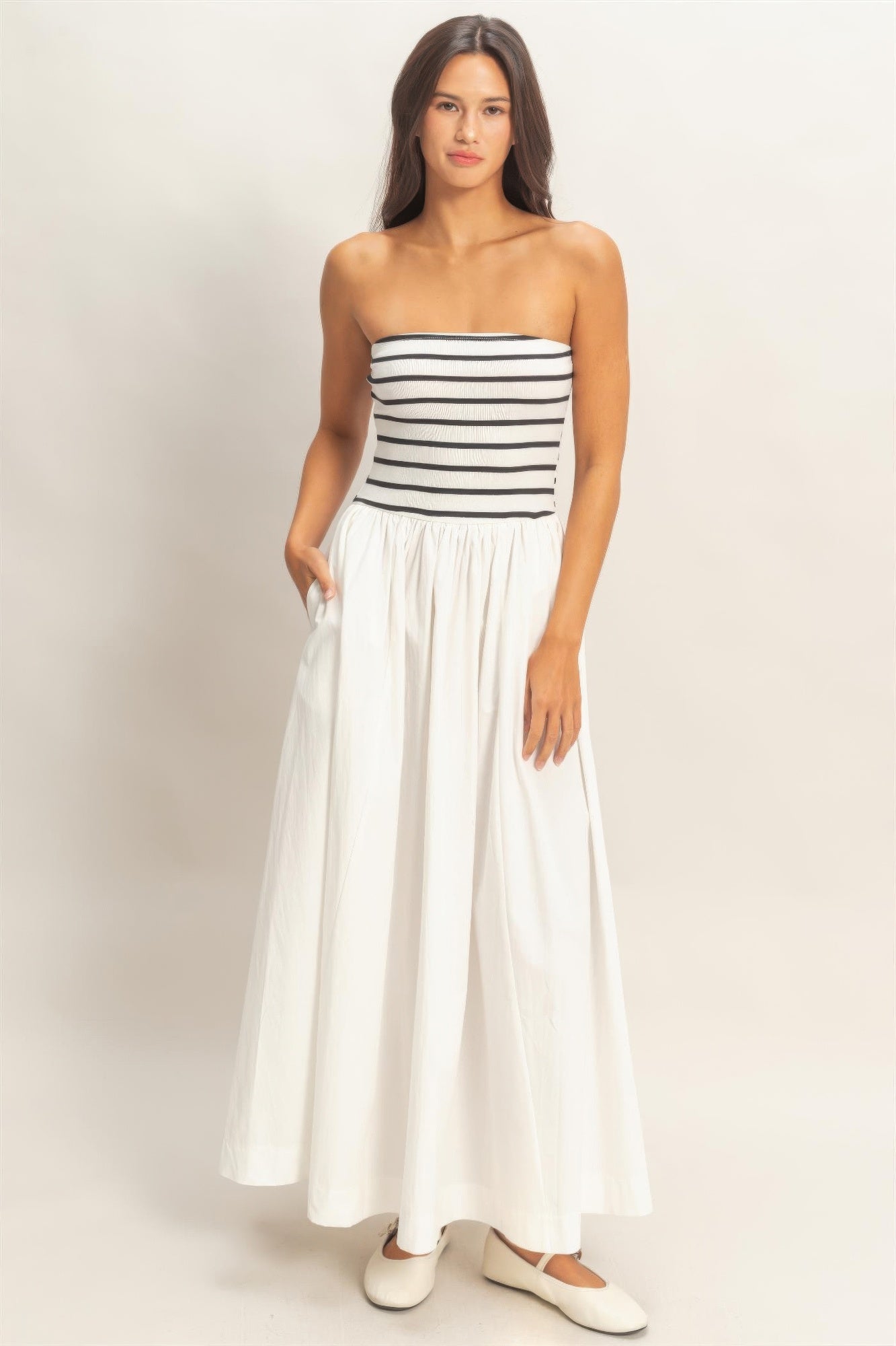Black-and-white striped strapless flowy midi dress with pleated skirt