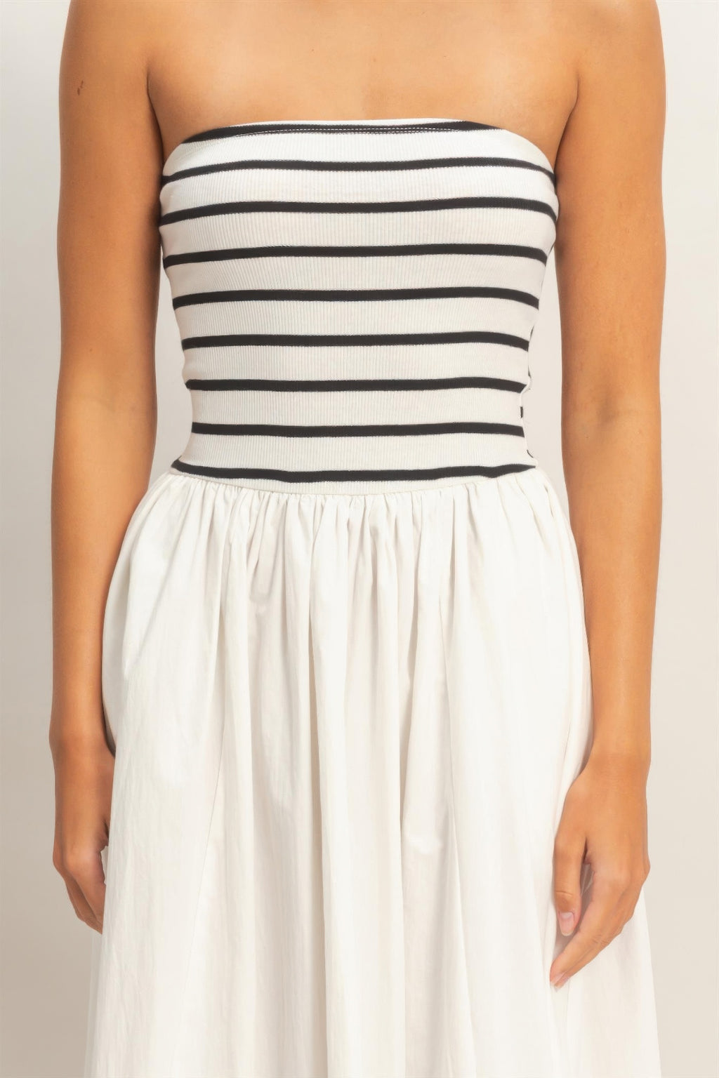 Strapless bodice with black-and-white horizontal stripes and gathered waist