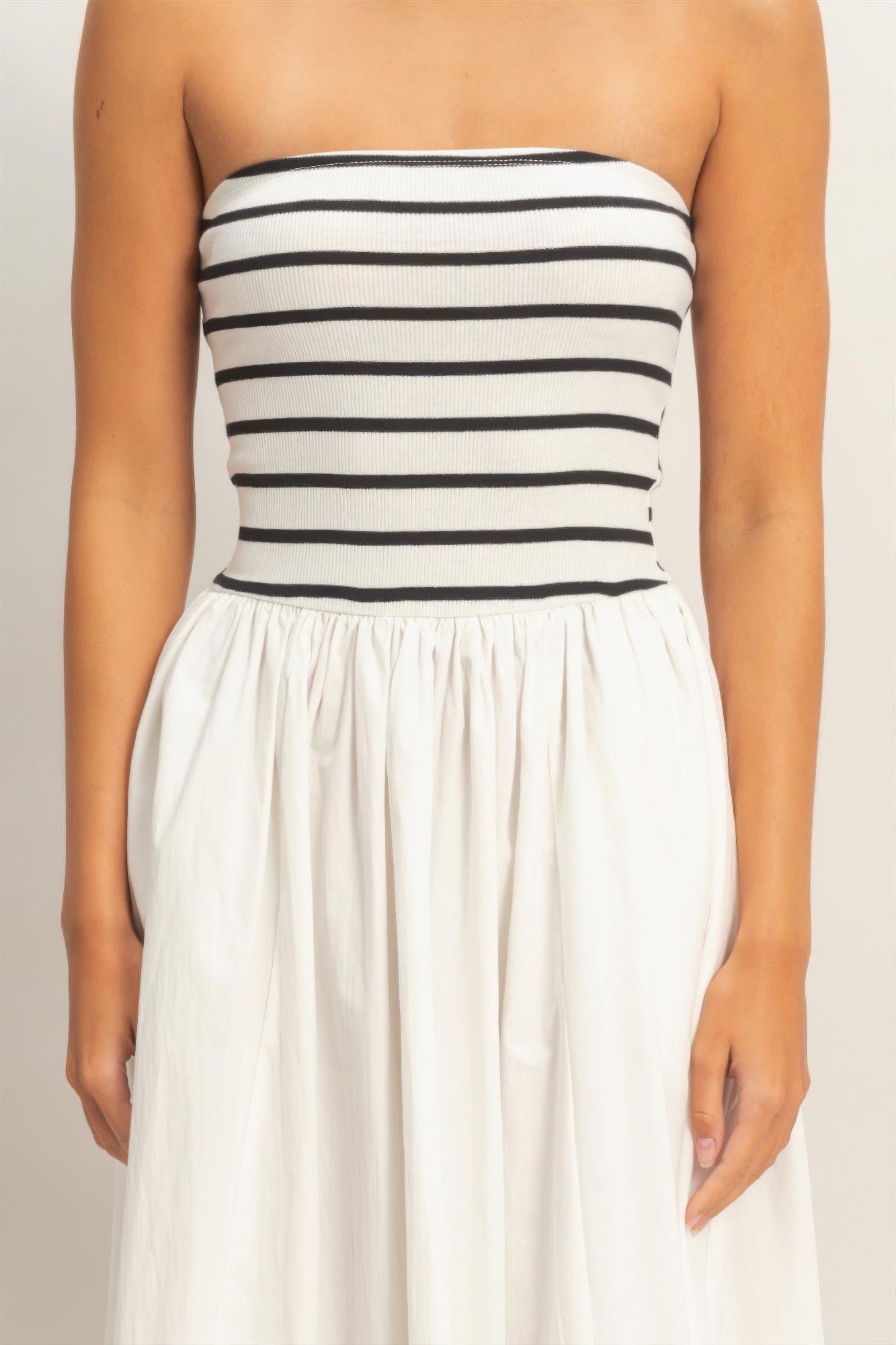 Strapless bodice with black-and-white horizontal stripes and gathered waist