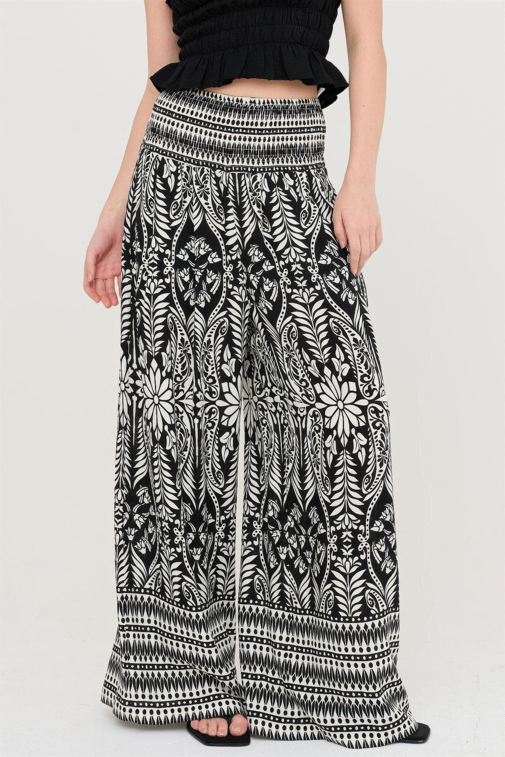 Smocked waist floral pants, black with white leafy botanical print