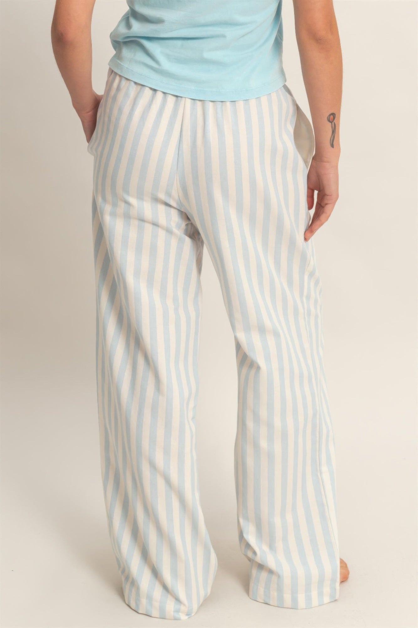 Light blue/white vertical striped wide-leg pants with elastic waistband and side pockets