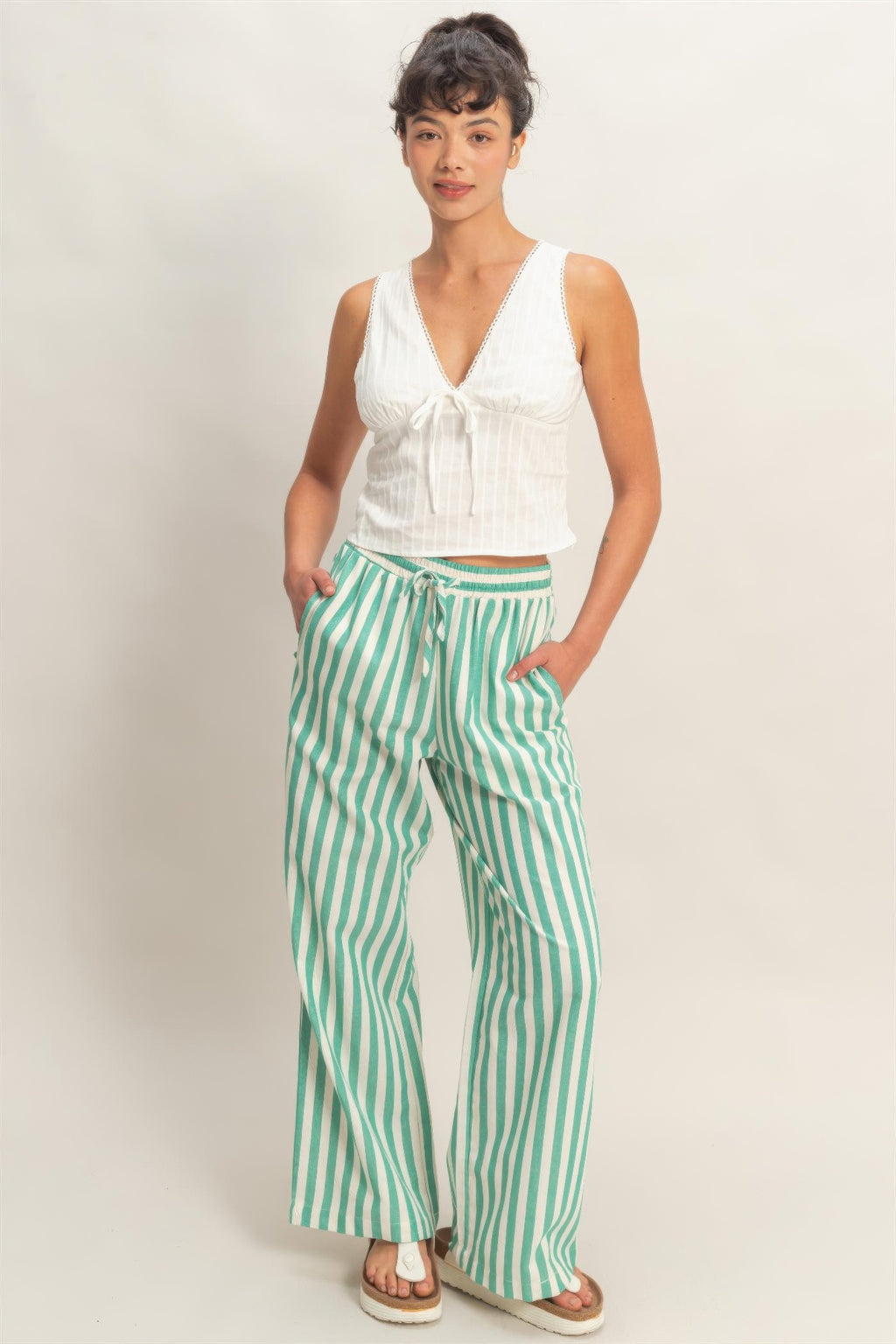 Green-and-white striped wide-leg pants, elastic waist with drawstring ties