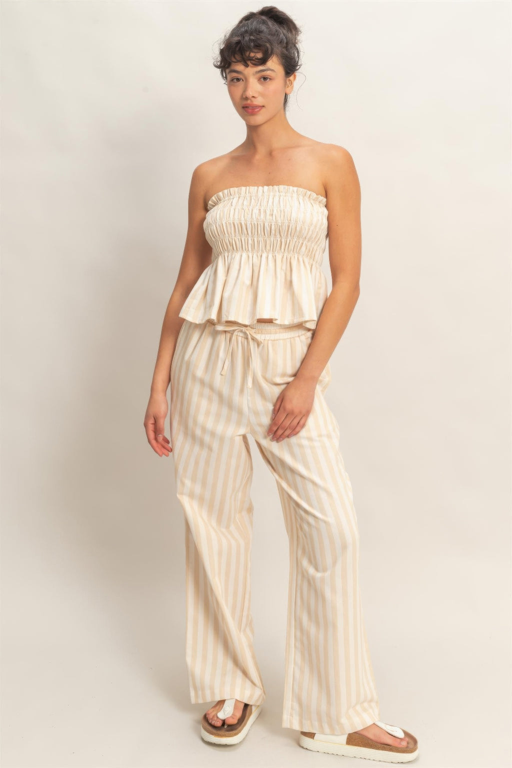 Taupe-and-cream vertical striped elastic pants with elastic waistband, drawstring, side pockets
