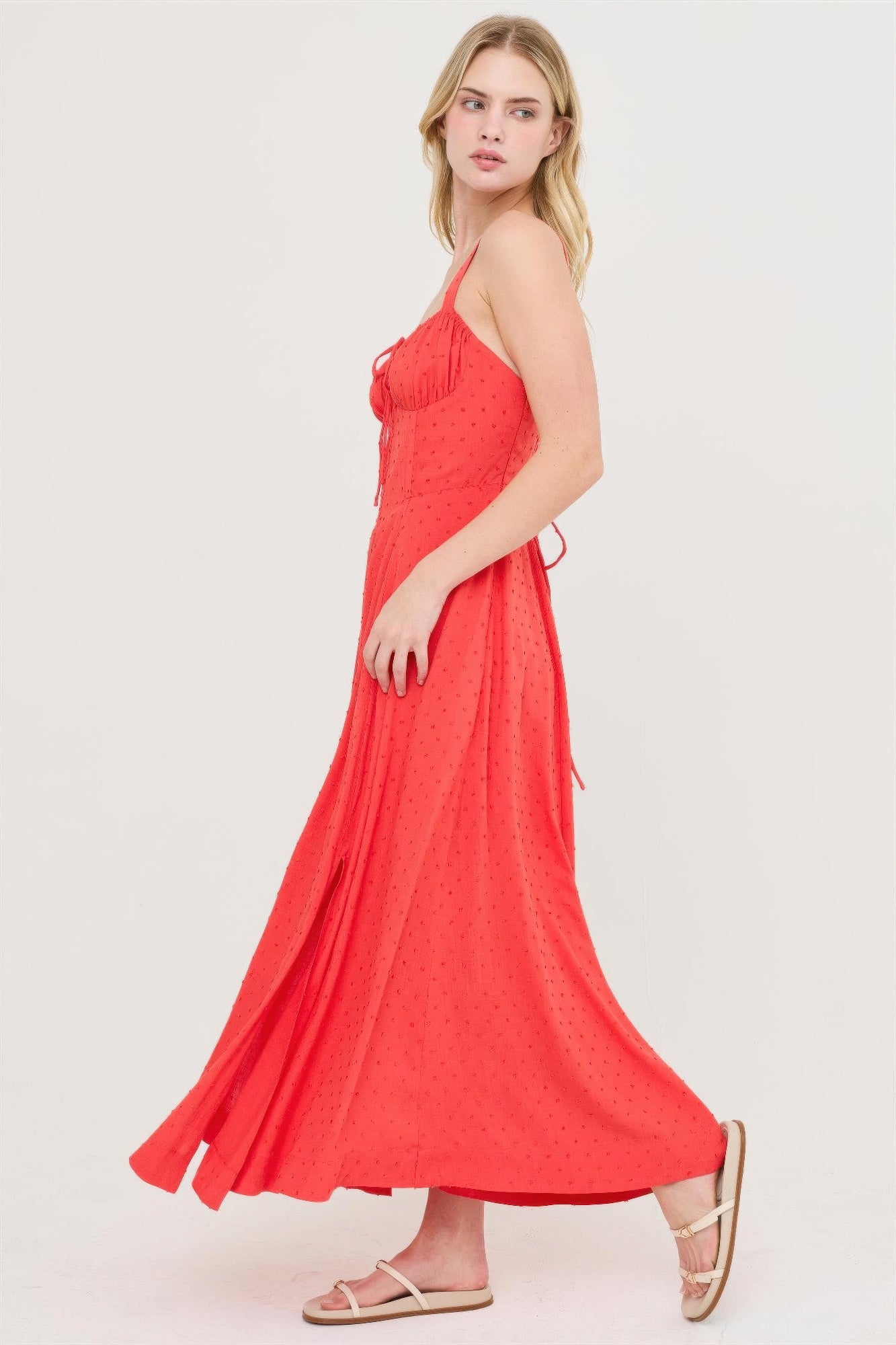 Blood orange boned tie-back dress, side view shows flowing midi skirt and straps