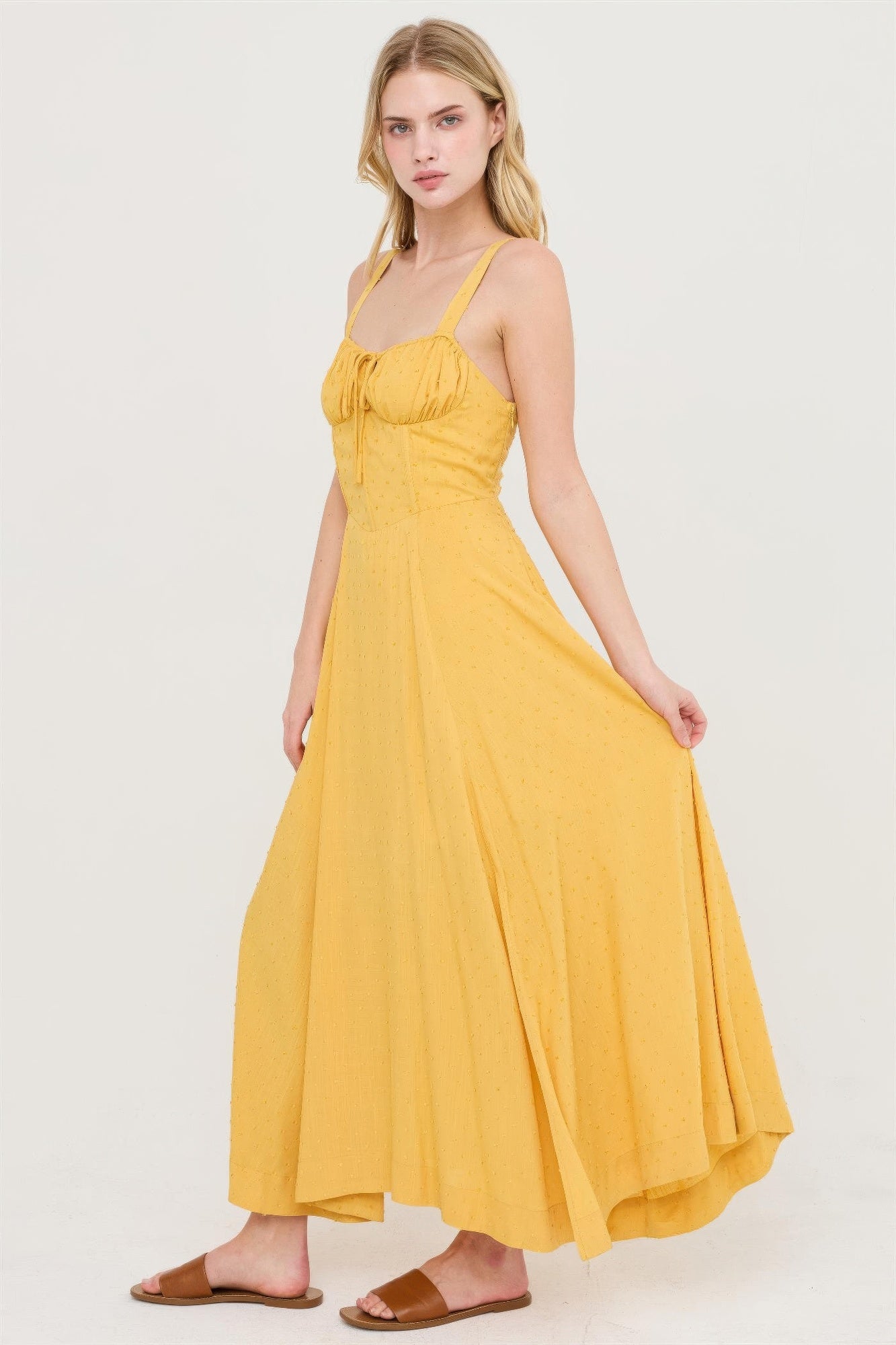 Mustard yellow tie-back midi dress with square neckline and gathered bodice.
