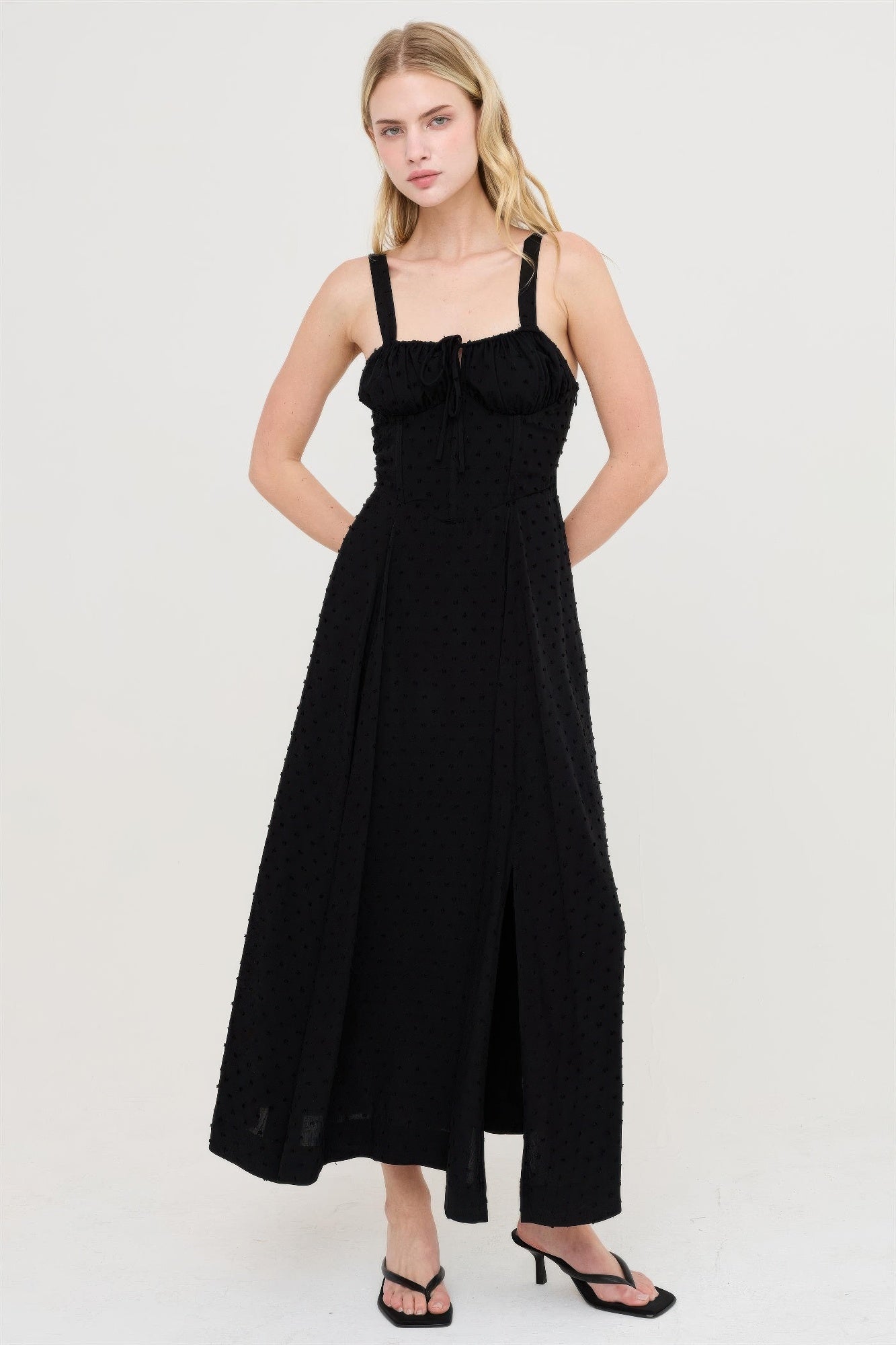 Black boned tie-back dress, square neckline, fitted bodice with soft flare midi hem