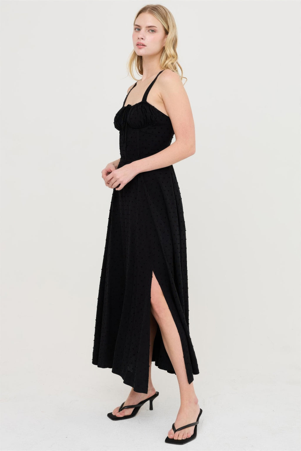 Black boned tie-back midi dress with sweetheart neckline and side slit.