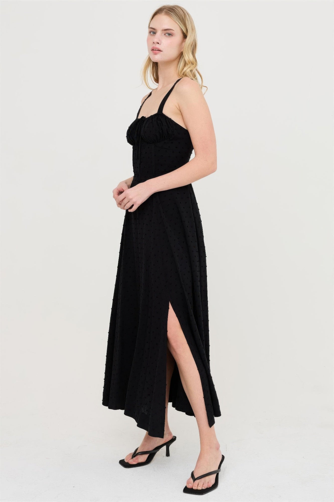 Black boned tie-back midi dress with sweetheart neckline and side slit.