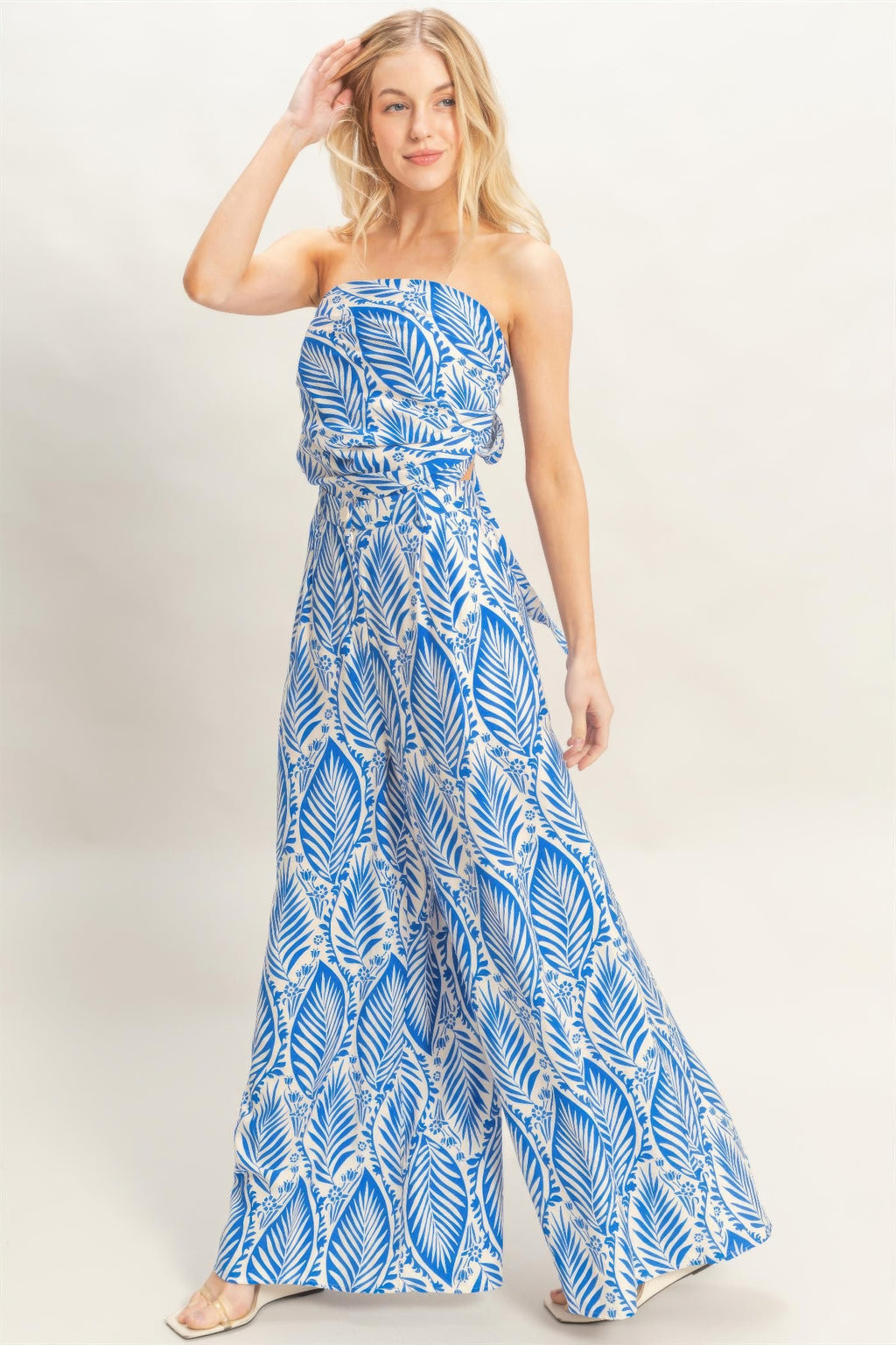 Blue leaf-print strapless top and wide-leg pant set with tied waist detail