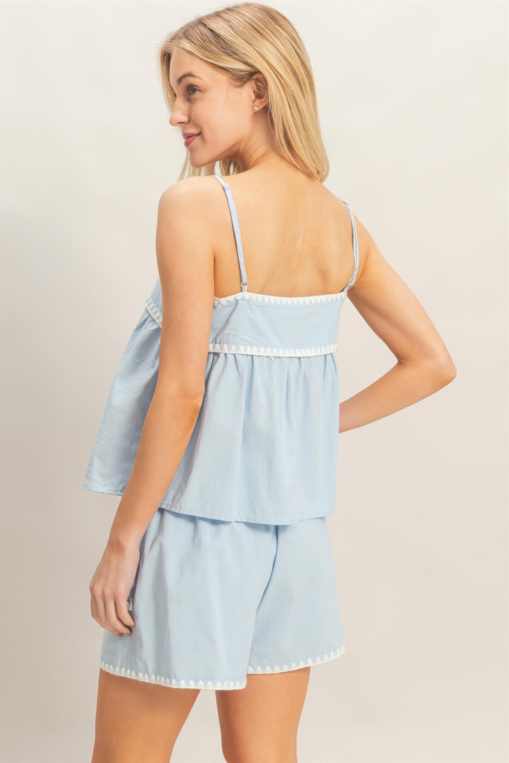 Side/back light blue babydoll top with thin straps and tiered ruffle layers