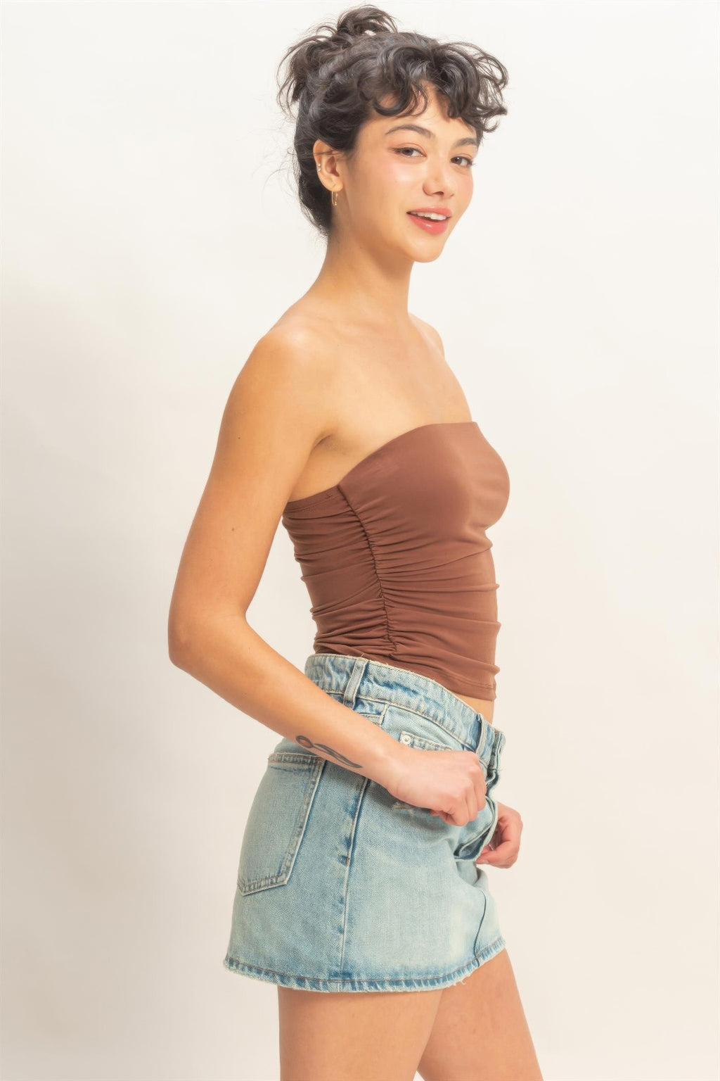 Chocolate ruched bandeau top with strapless sweetheart neckline and fitted ruched sides.