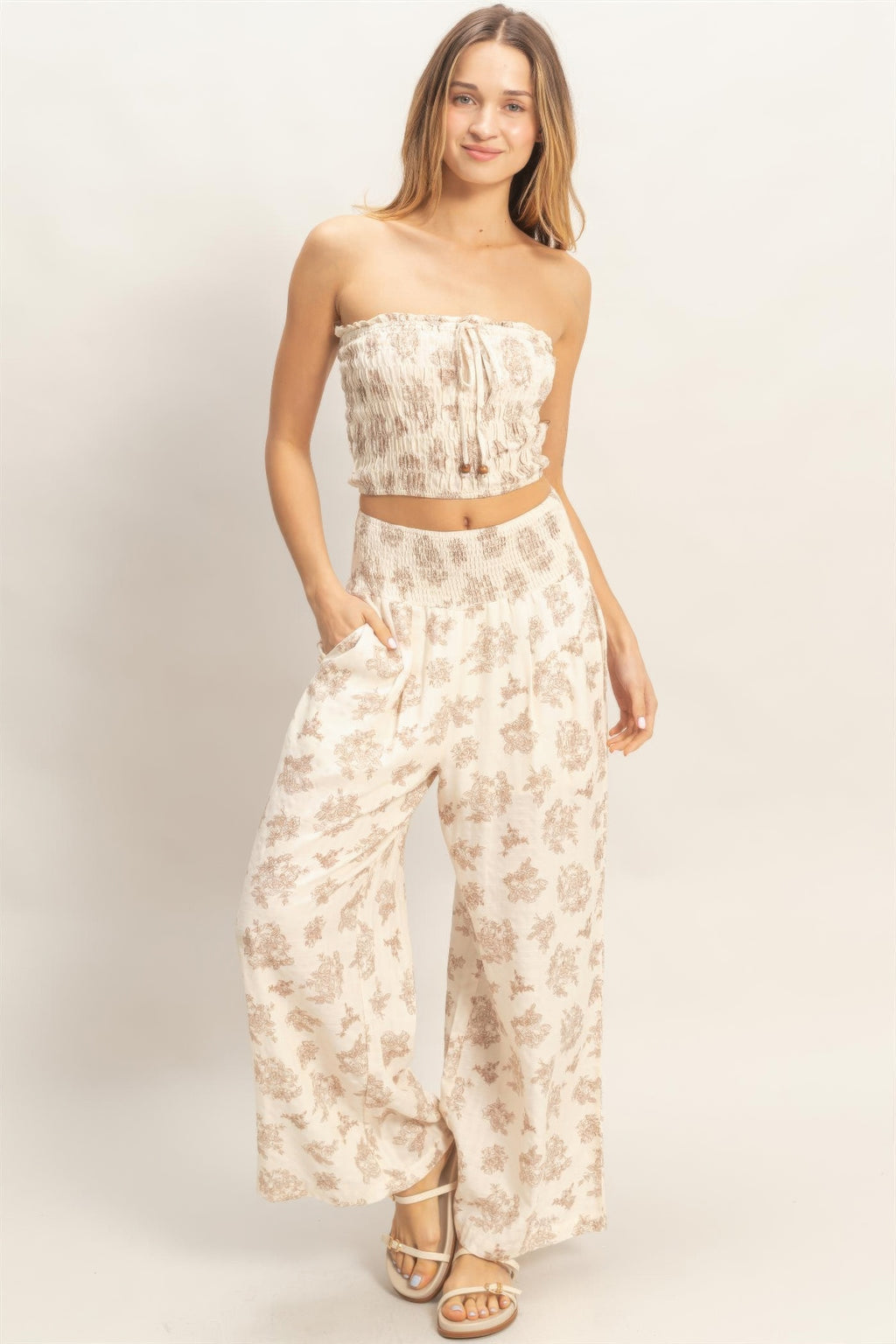 Floral smocked tube crop top with matching wide-leg pants, beige set
