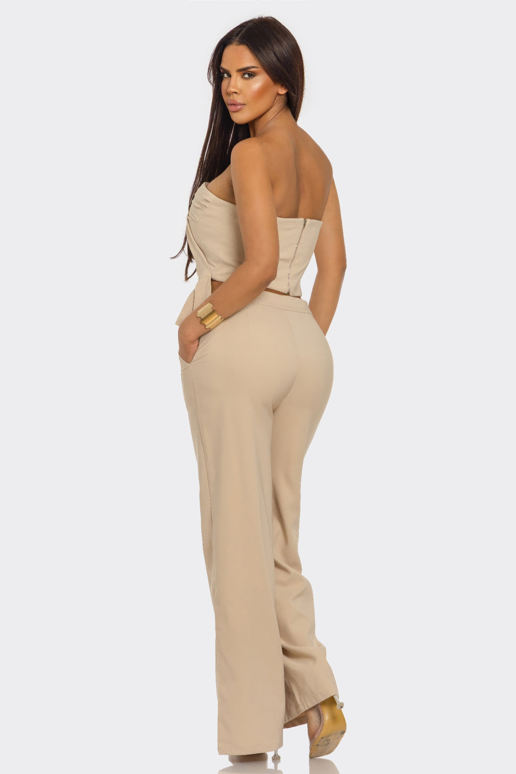 Taupe two-piece set, back/side view: strapless peplum top and wide-leg pants