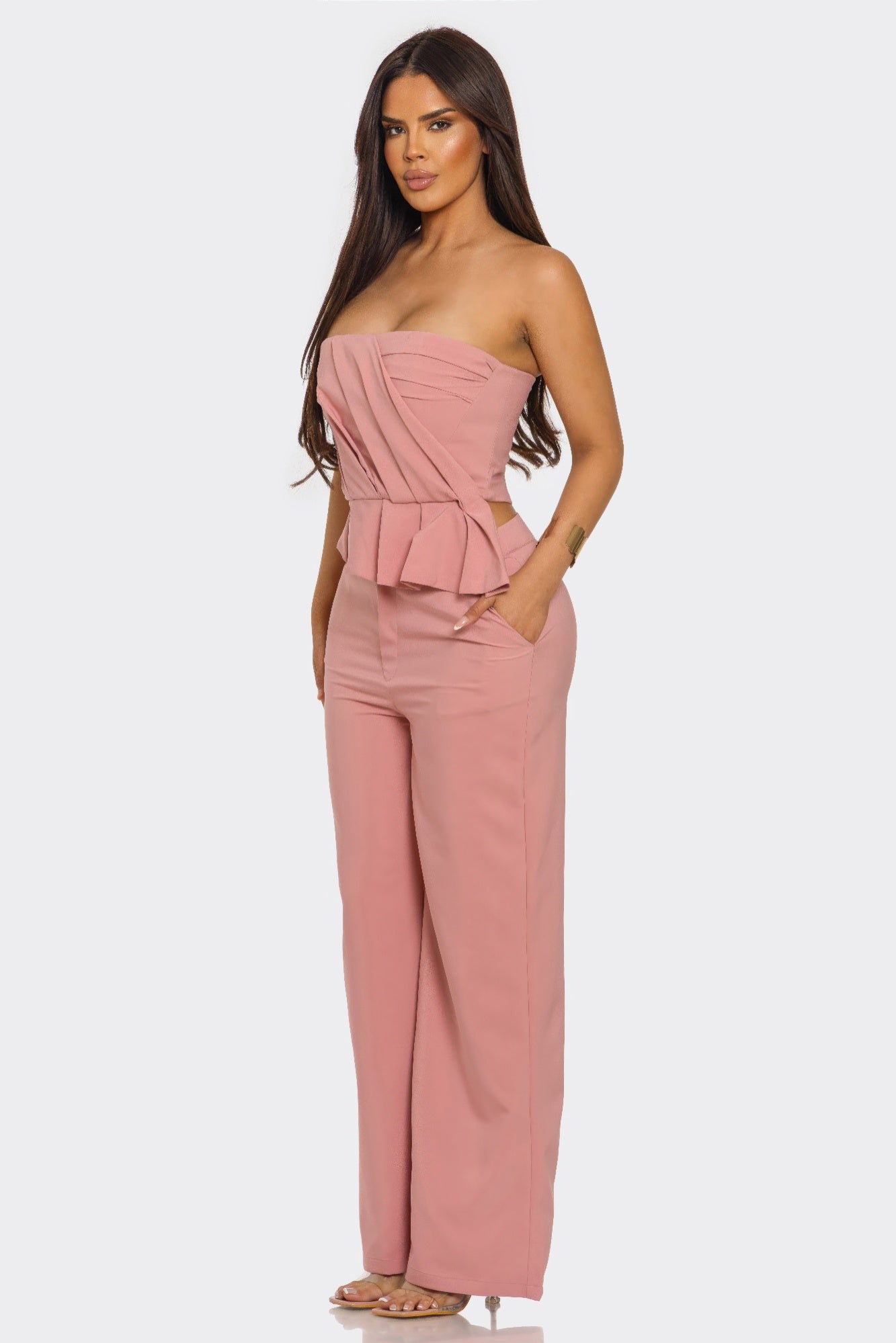 Mauve two-piece set, side view: strapless peplum top and wide-leg pants