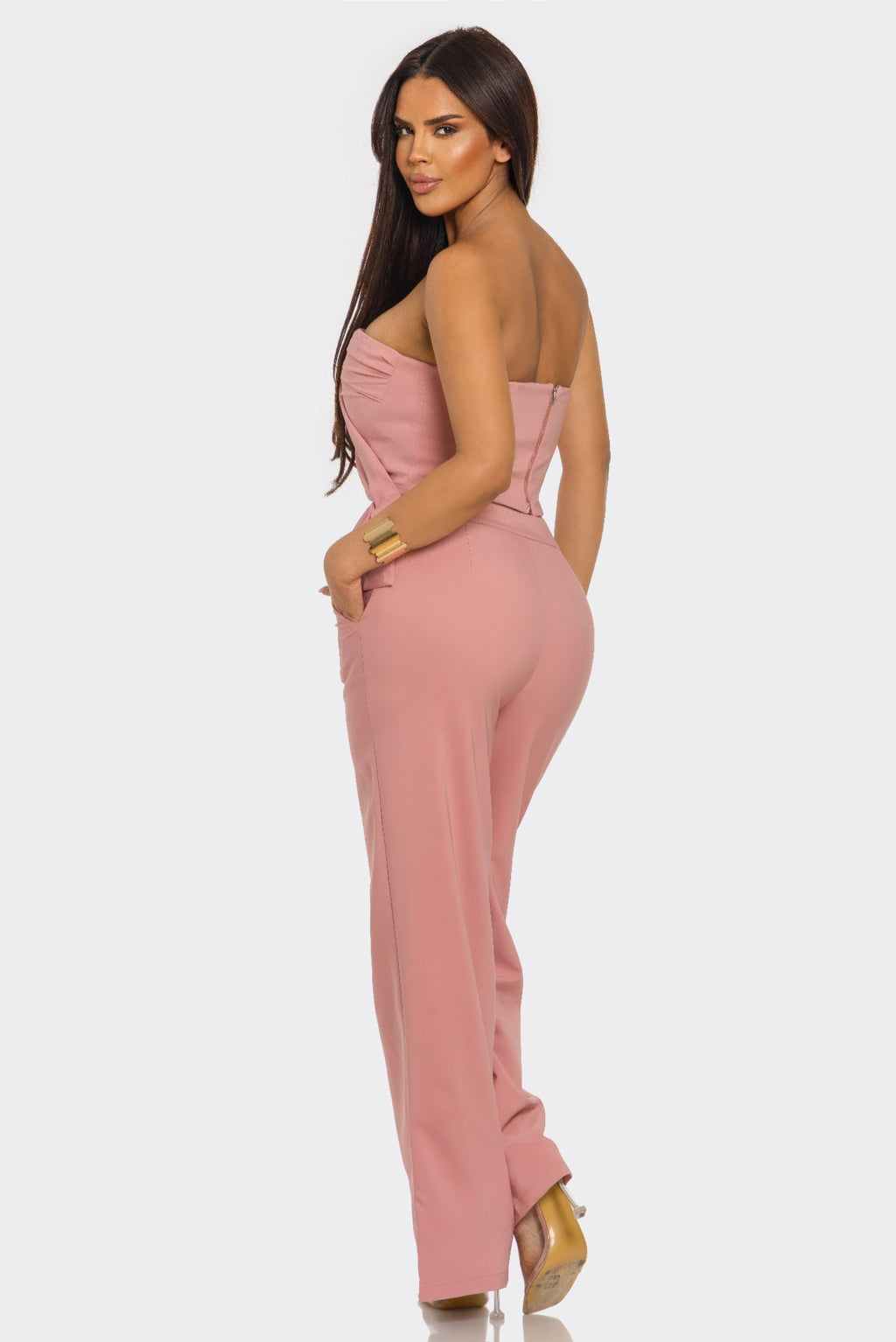 Mauve two-piece set, back/side view: strapless peplum top and wide-leg pants