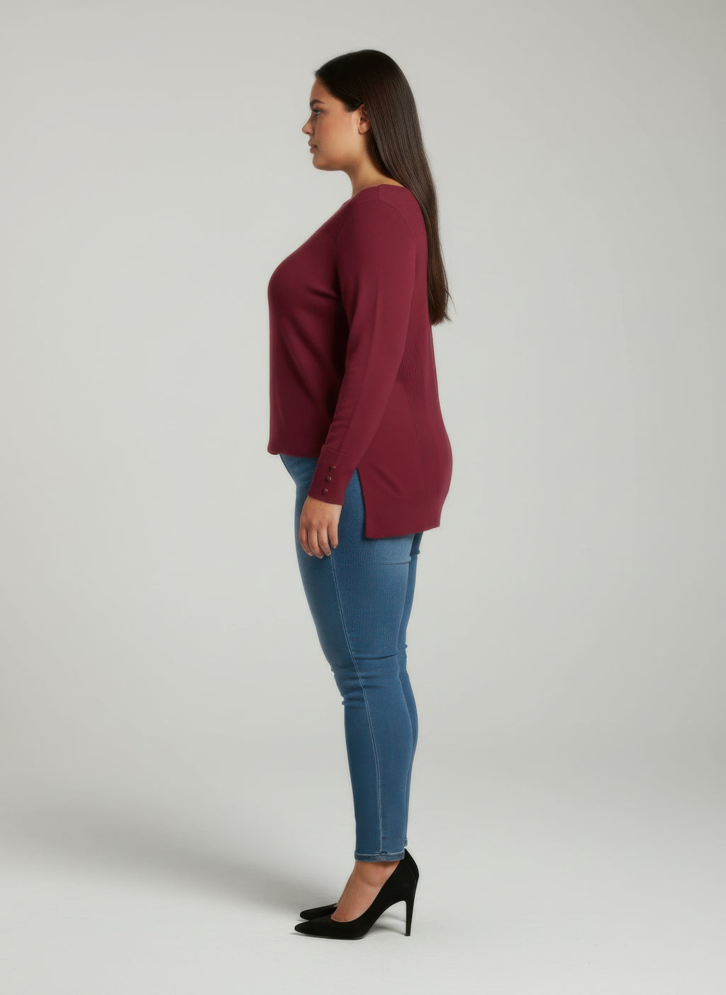 Side view: wine ribbed knit tunic top with button cuffs
