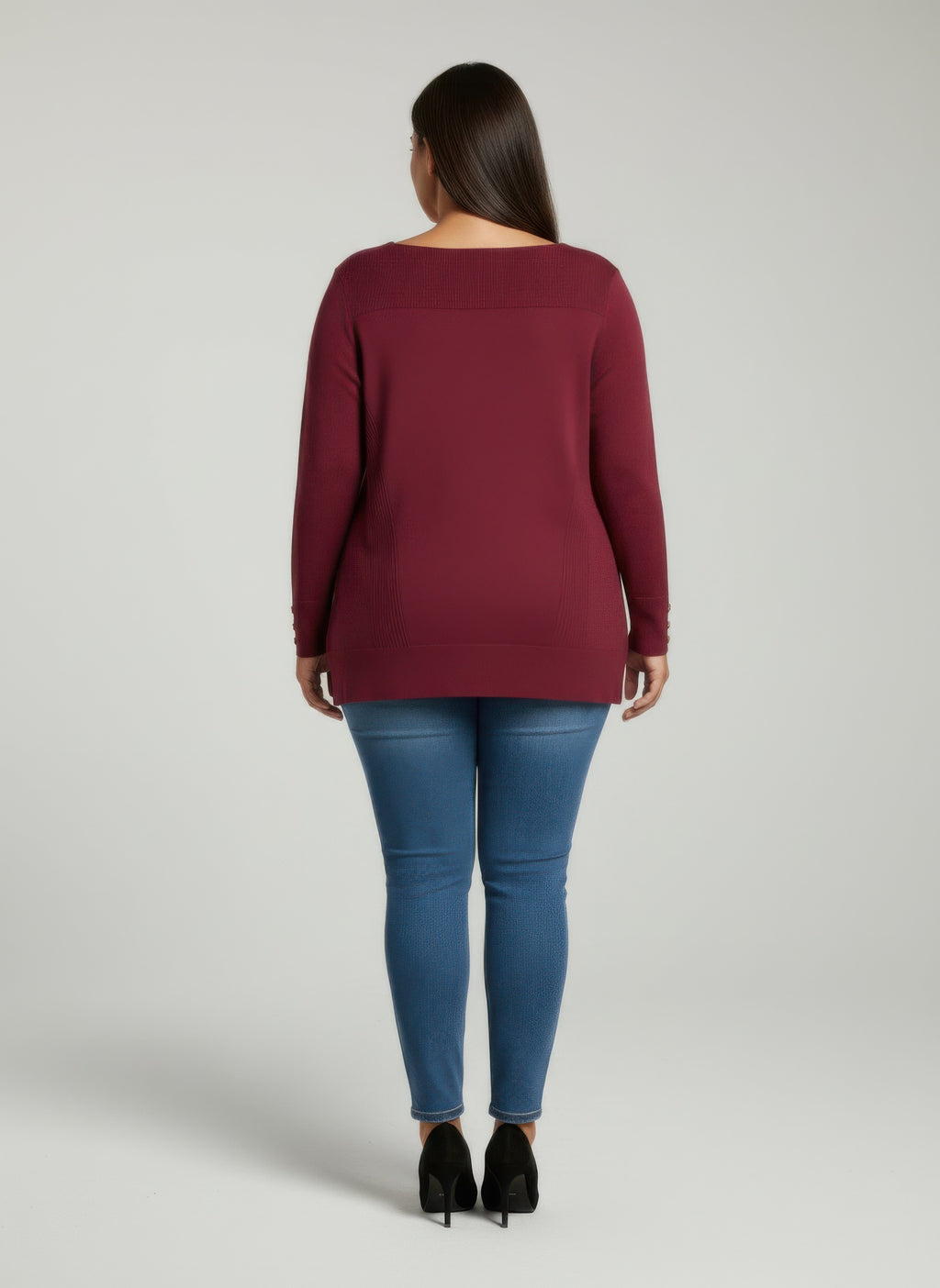 Back view: wine ribbed knit tunic top, button cuffs detail