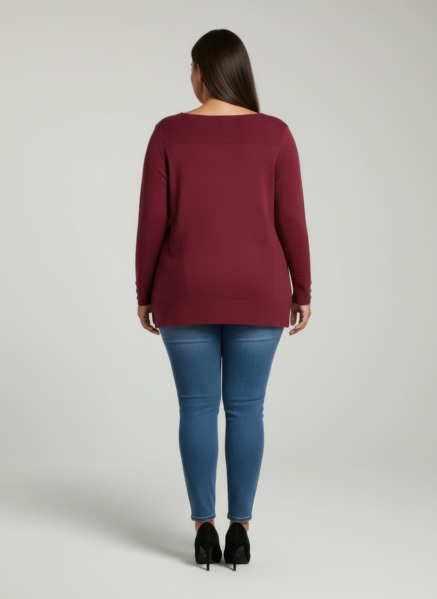 Back view: wine ribbed knit tunic top, button cuffs detail