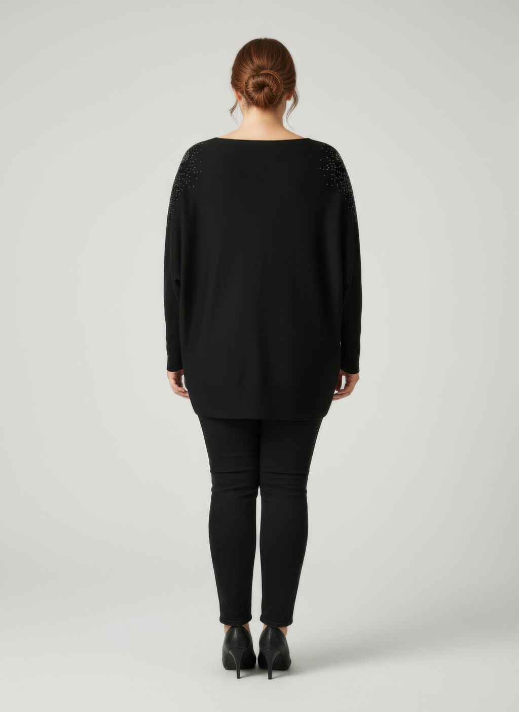 Black dolman sleeve tunic top, back view