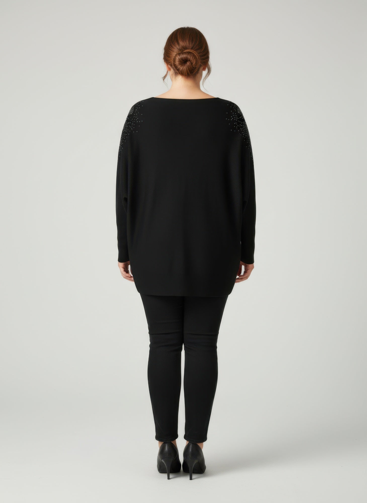 Black dolman sleeve tunic top, back view
